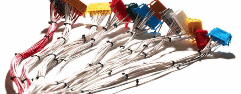 A collection of colorful wires arranged in a cable harness, showcasing various colours and configurations.